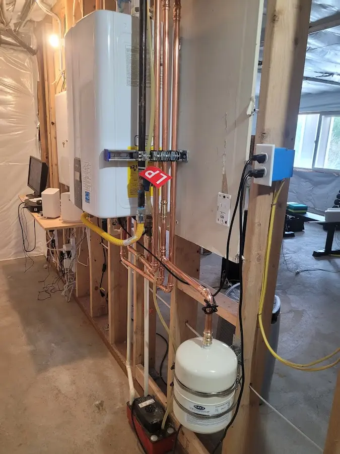 Licensed plumber repairing a kitchen sink in Turner